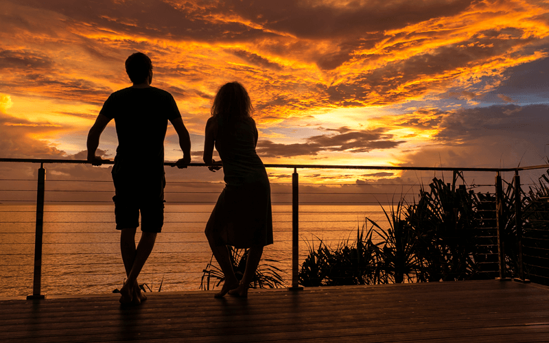 Guests enjoying Christmas Island sunset over the ocean at Swell Lodge during dry season